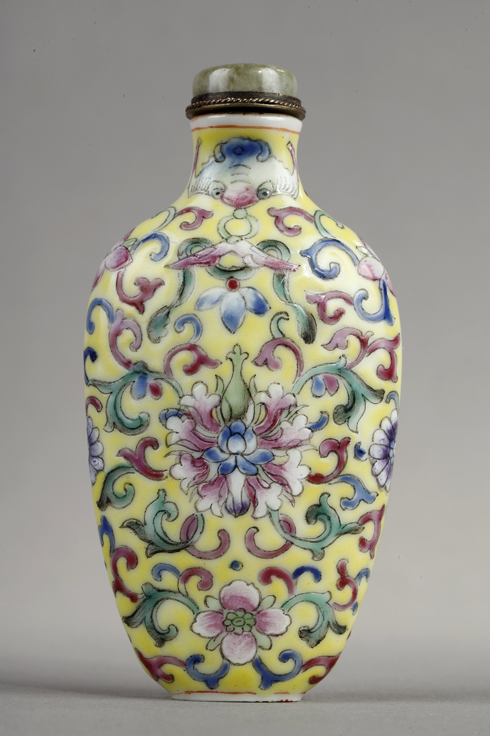 Snuff Bottles : Snuff bottle porcelain has a polychrome decor of stylized flowers and foliage.
China 1890/1930