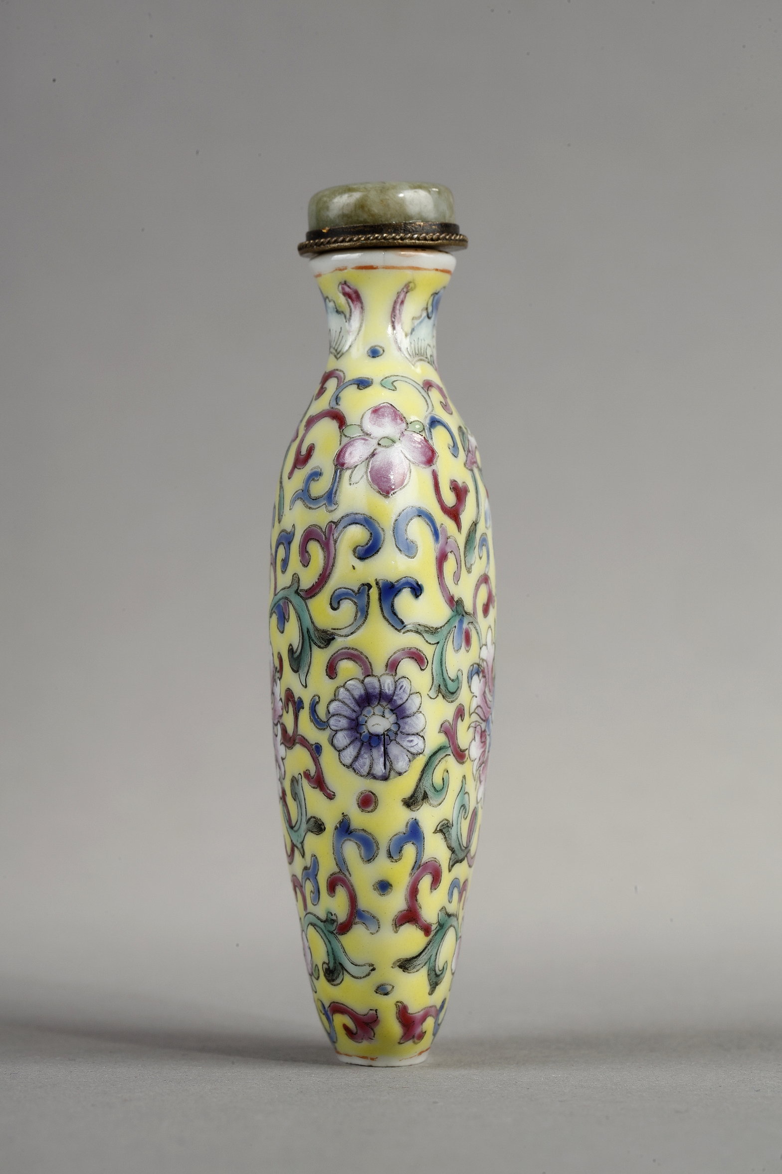 Snuff Bottles : Snuff bottle porcelain has a polychrome decor of stylized flowers and foliage.
China 1890/1930