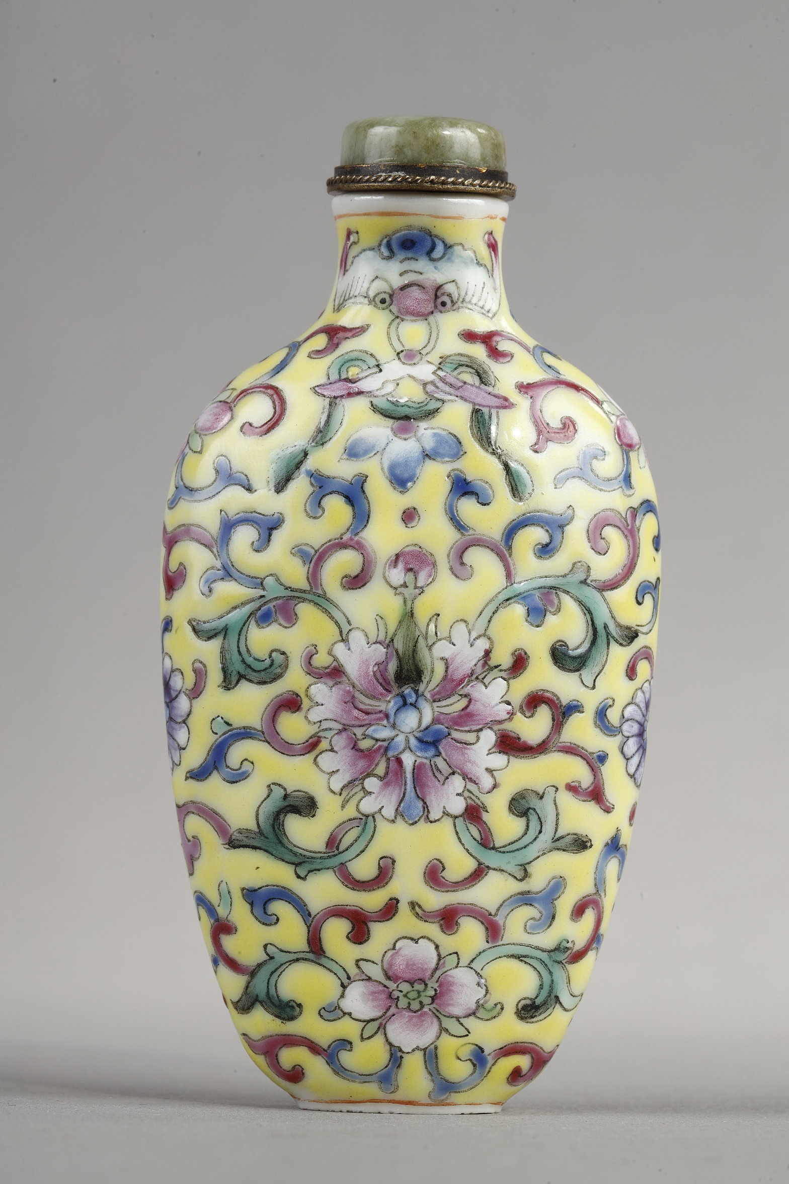 Snuff Bottles : Snuff bottle porcelain has a polychrome decor of stylized flowers and foliage.
China 1890/1930