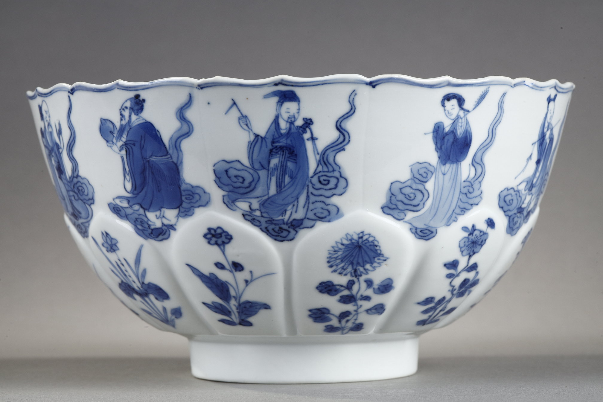 Blue White : porcelain bowl "blue white" molded in the shape of flower petals and decorated with immortals 
Kangxi mark and period  1662/1722
