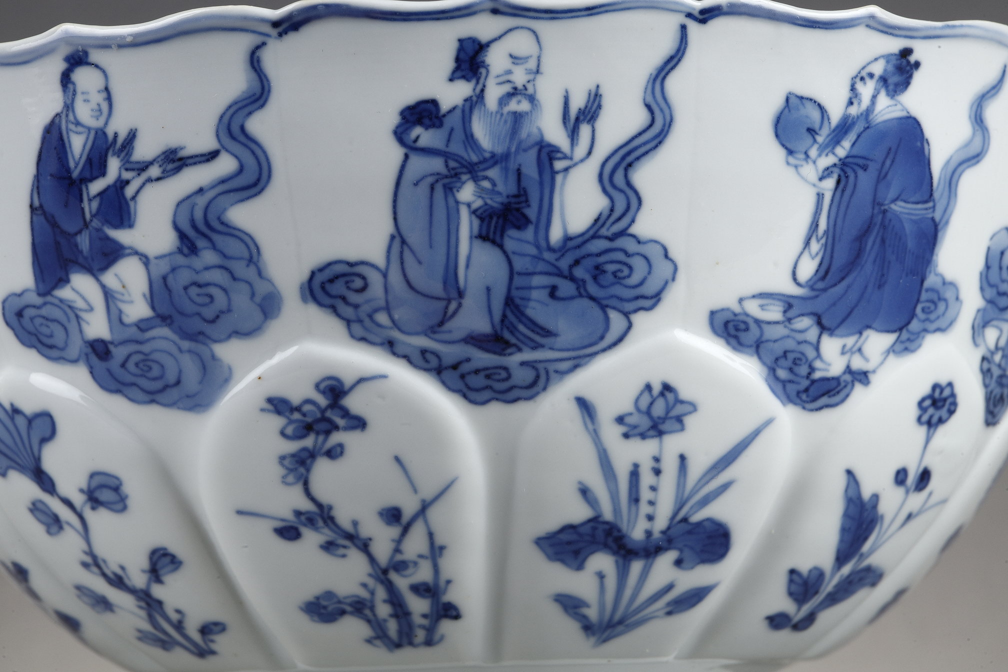 Blue White : porcelain bowl "blue white" molded in the shape of flower petals and decorated with immortals 
Kangxi mark and period  1662/1722