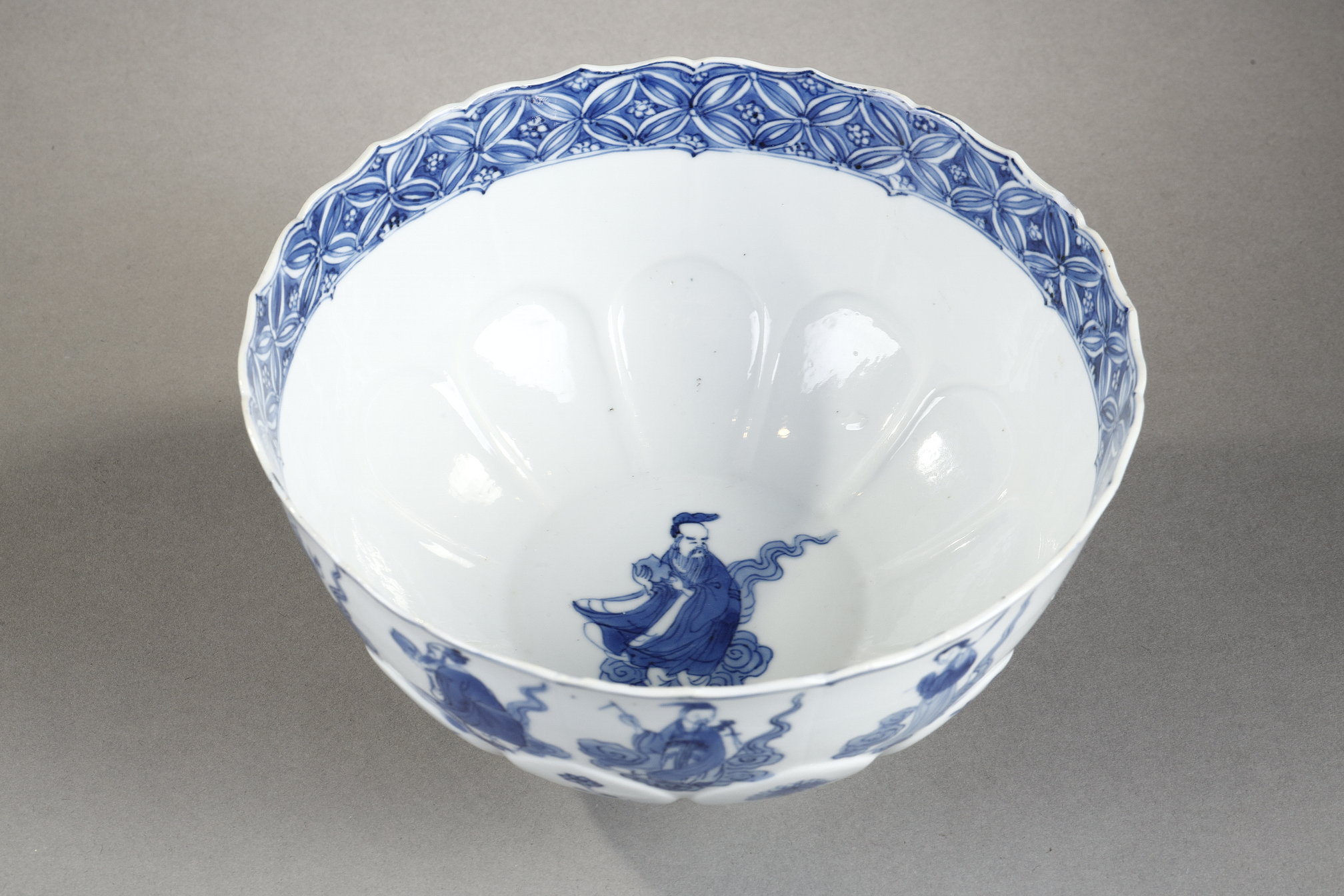Blue White : porcelain bowl "blue white" molded in the shape of flower petals and decorated with immortals 
Kangxi mark and period  1662/1722