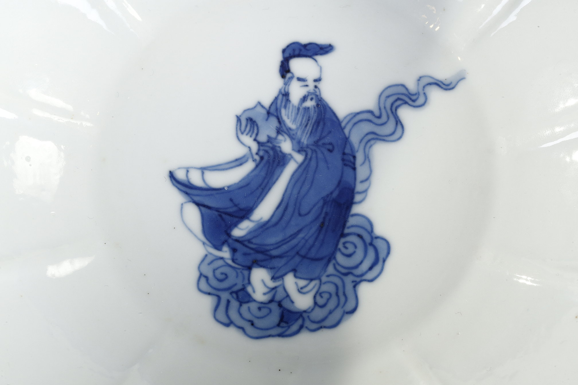 Blue White : porcelain bowl "blue white" molded in the shape of flower petals and decorated with immortals 
Kangxi mark and period  1662/1722