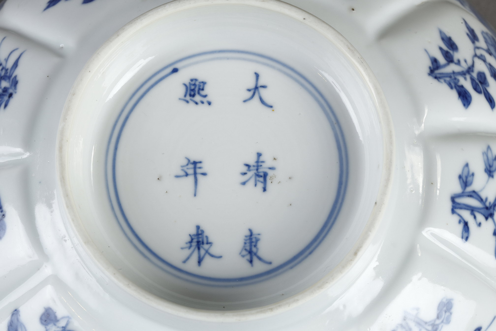 Blue White : porcelain bowl "blue white" molded in the shape of flower petals and decorated with immortals 
Kangxi mark and period  1662/1722