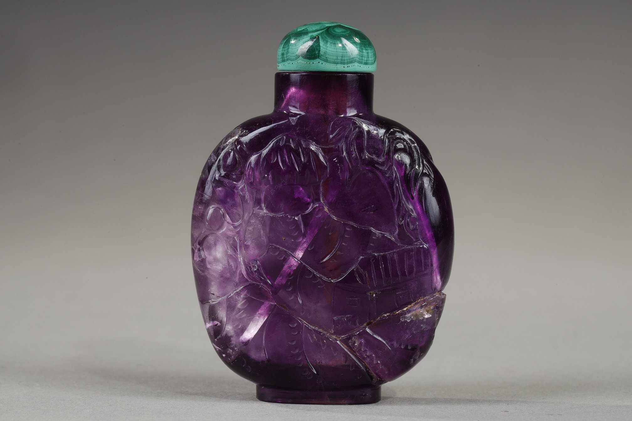 Snuff Bottles : snuff bottle in amethyst carved pagodas in landscapes 
China 19th century 