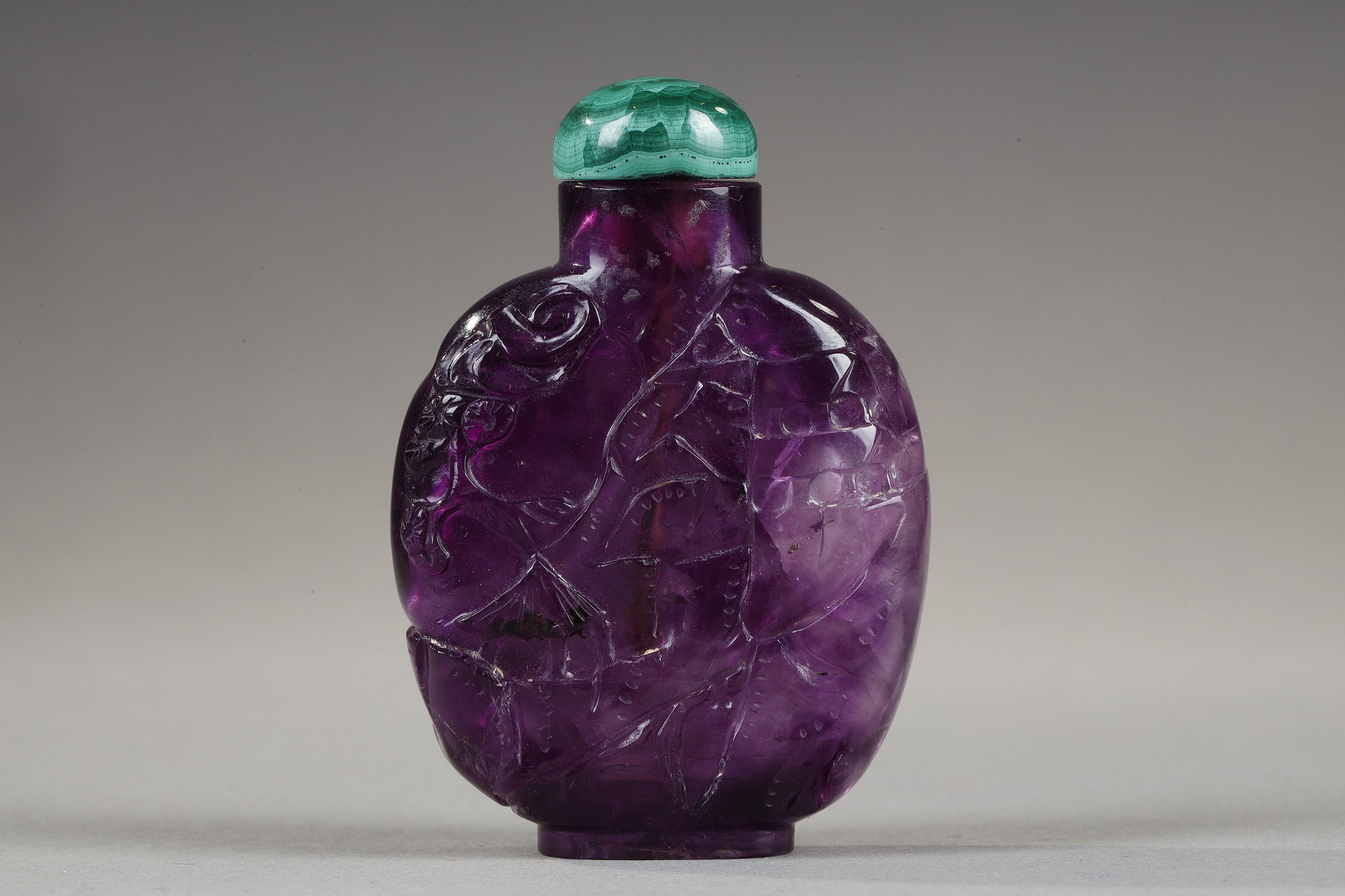 Snuff Bottles : snuff bottle in amethyst carved pagodas in landscapes 
China 19th century 