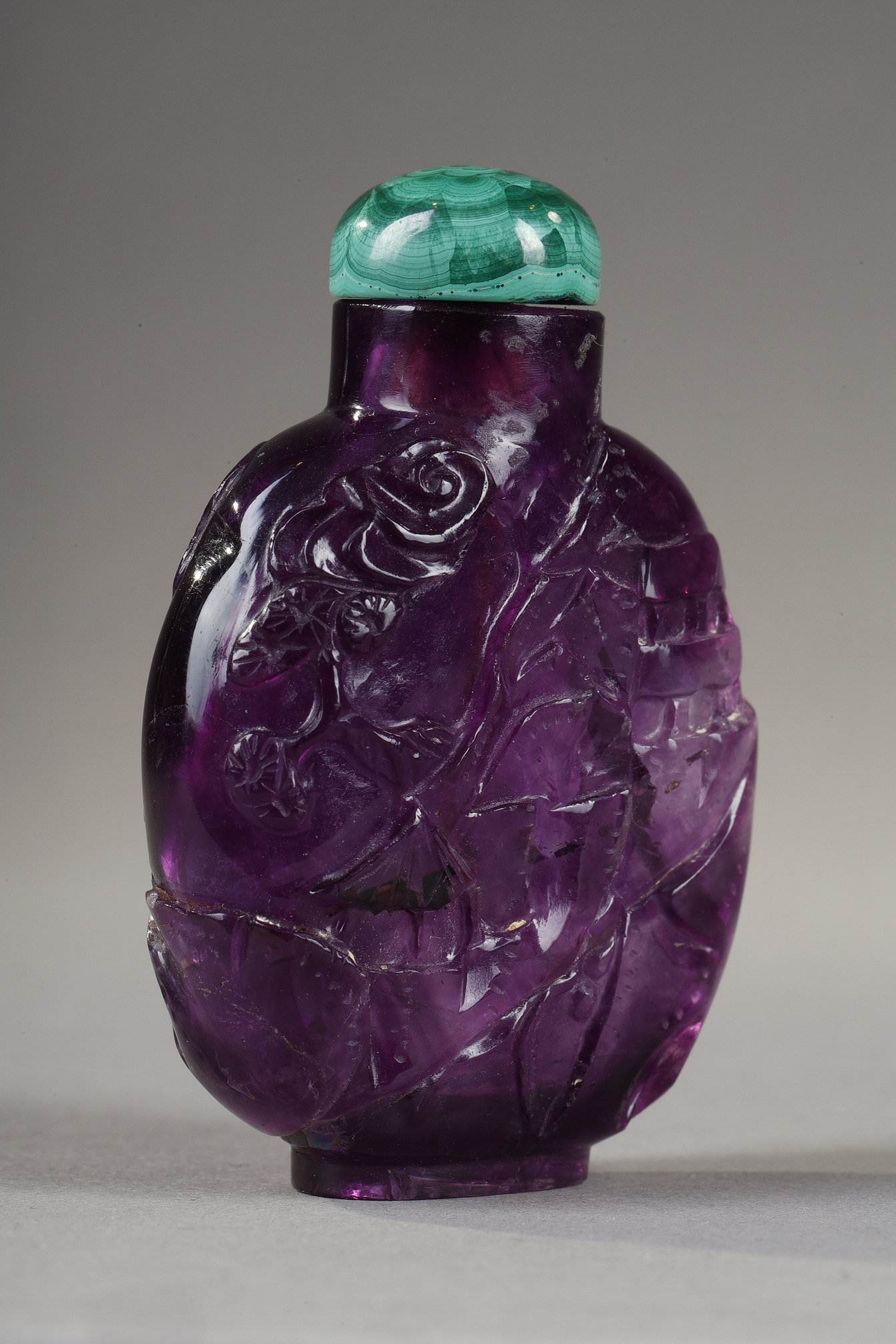 Snuff Bottles : snuff bottle in amethyst carved pagodas in landscapes 
China 19th century 