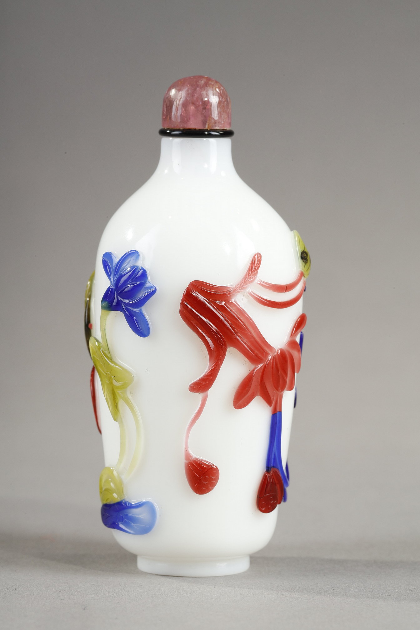 Snuff Bottles : Cylindrical shaped snuff bottle in three colors on opaque white background decorated with flowers and bamboo stems China 1780/1850