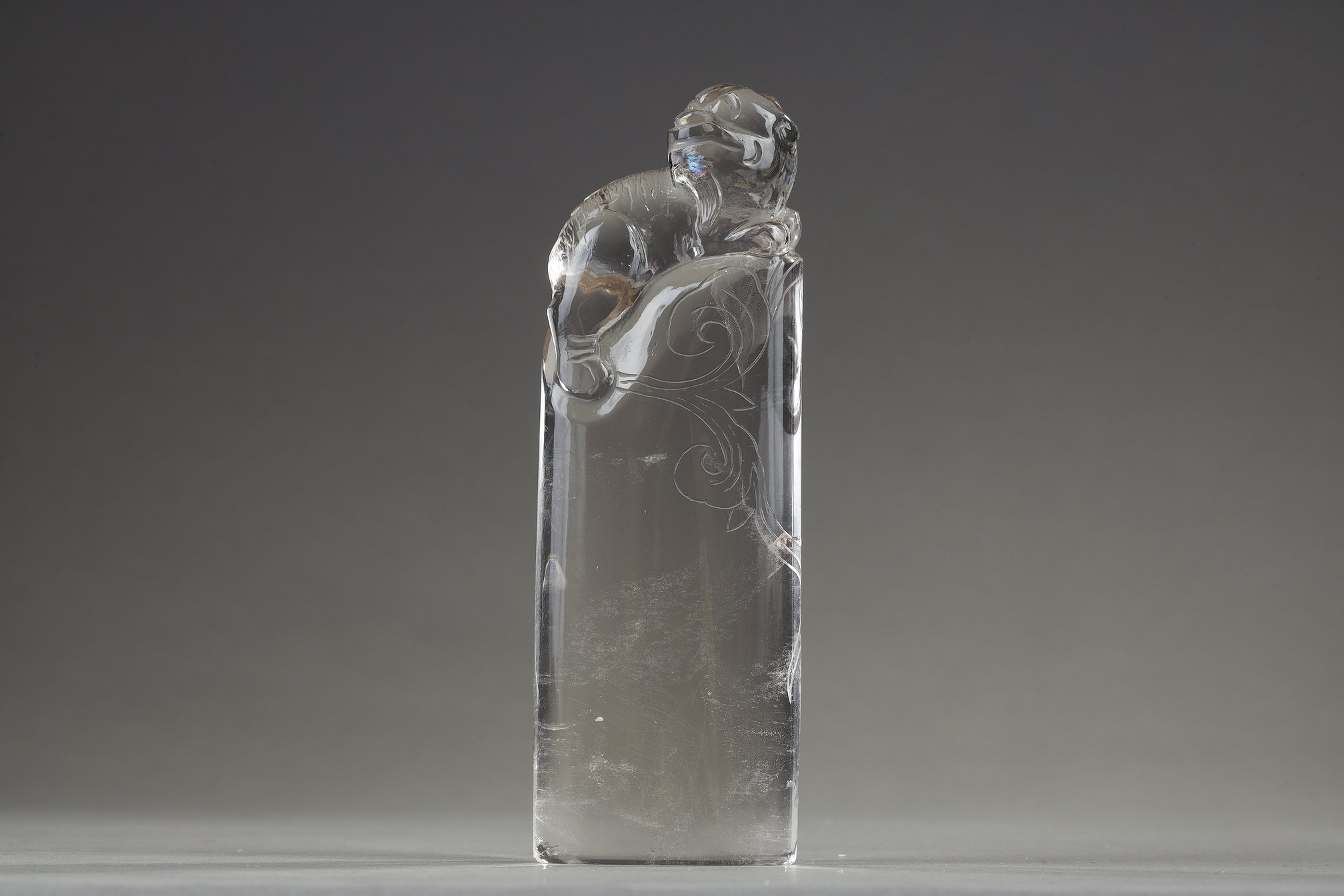 Works of Art :  Pure rock crystal seal surmounted by a carved fo dog. China 19th century