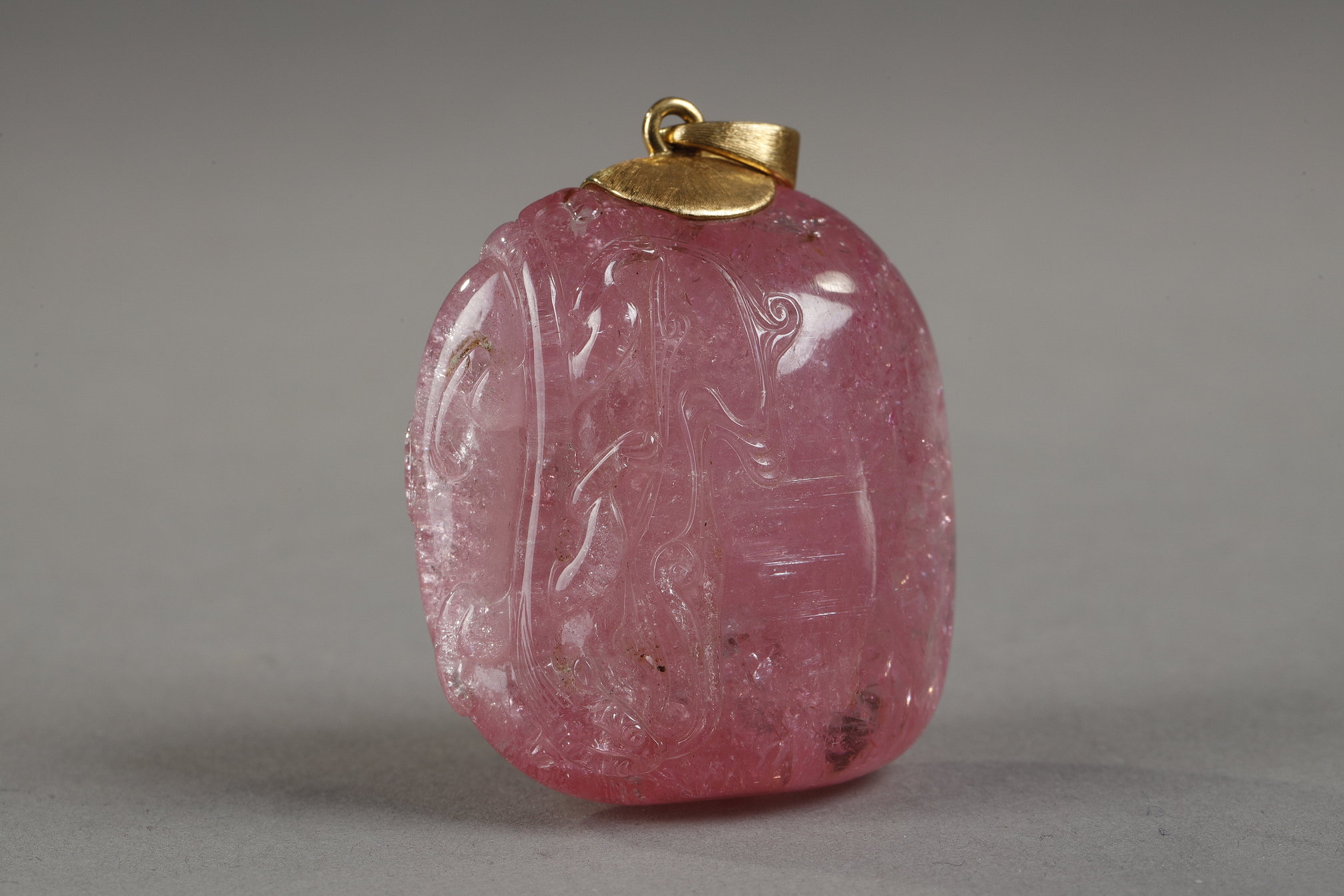 Works of Art : Tourmaline pendant finely sculpted in relief of a qilong holding a lingzhi branch - Chinese 19th century