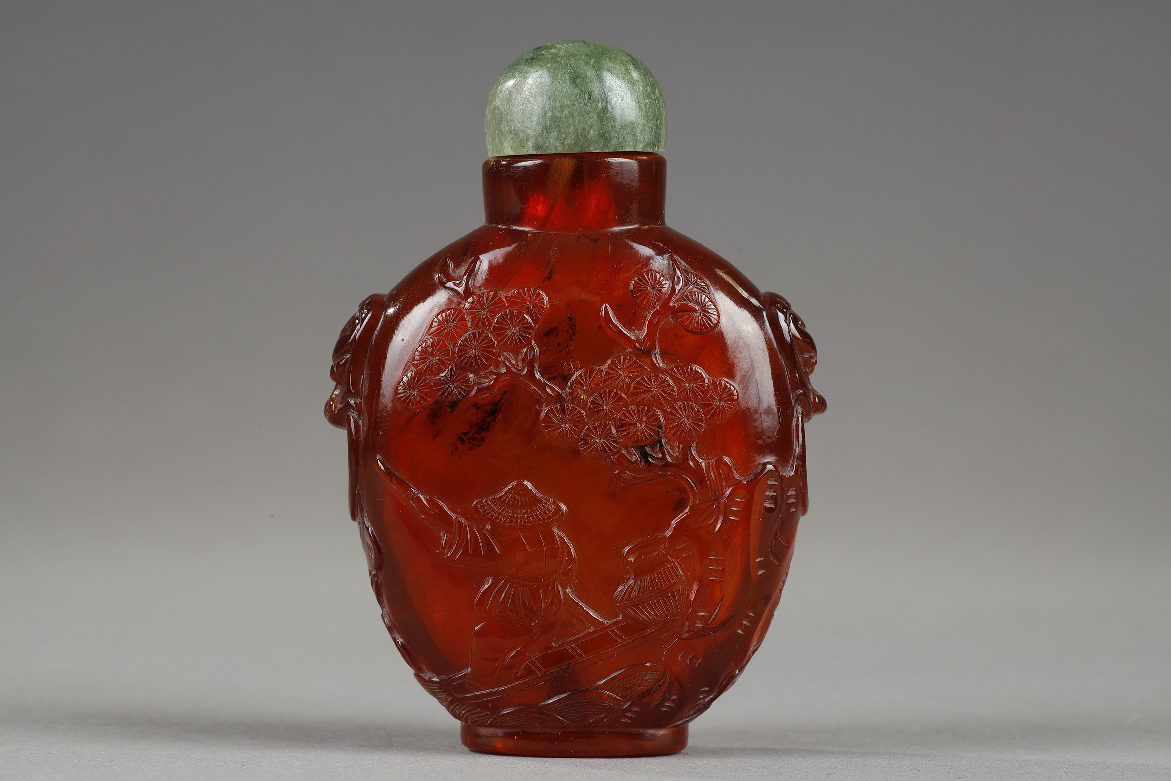 Snuff Bottles : Amber snuff bottle with carved decoration of a fisherman on one side and on the other of a boatman china circa 1790/1850