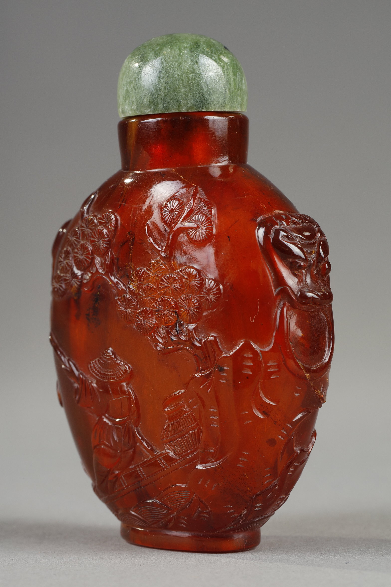 Snuff Bottles : Amber snuff bottle with carved decoration of a fisherman on one side and on the other of a boatman china circa 1790/1850