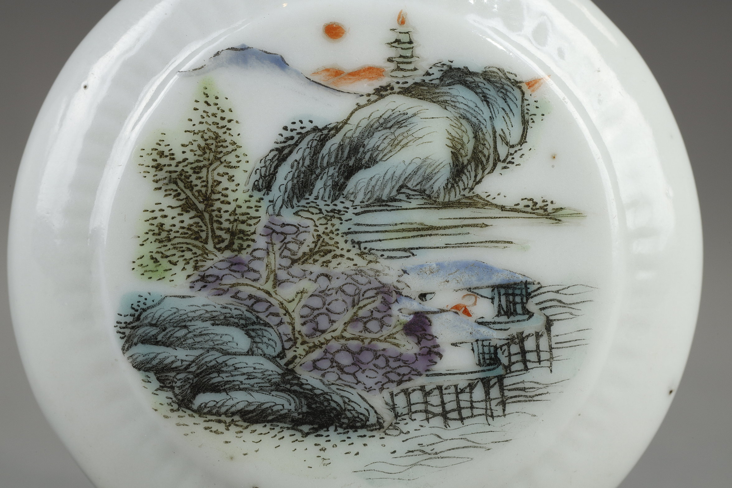 Snuff Bottles : two porcelain snuff bottles in the form of watches painted in polychrome landscapes in the style of traditional Chinese painting. China 19th century