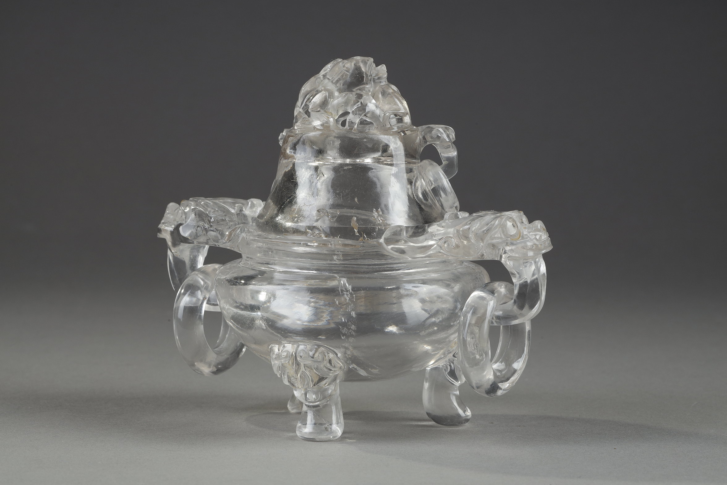 Works of Art : small rock crystal perfume burner
 carved with Taotie masks and rings . china 19th century