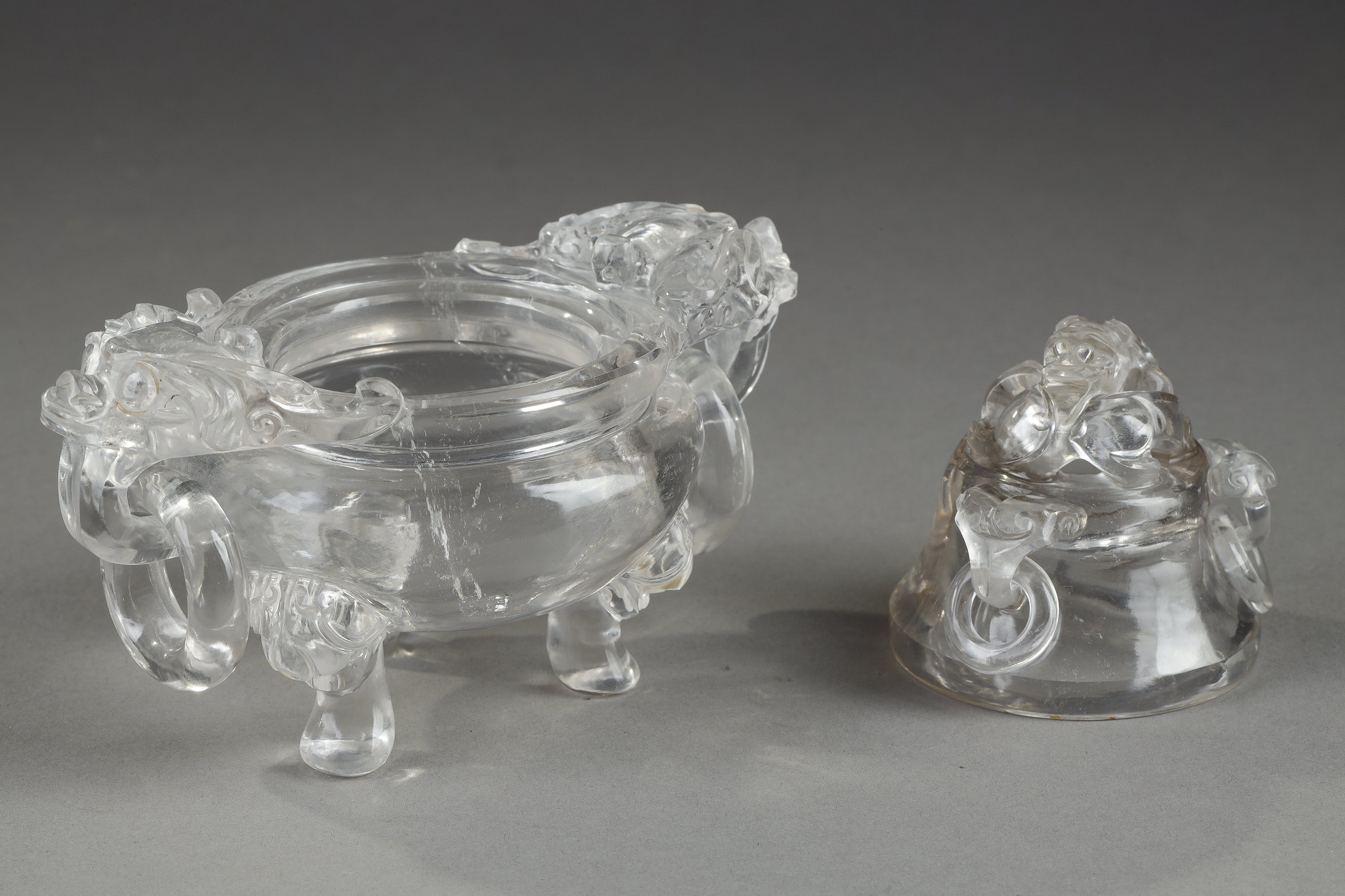 Works of Art : small rock crystal perfume burner
 carved with Taotie masks and rings . china 19th century