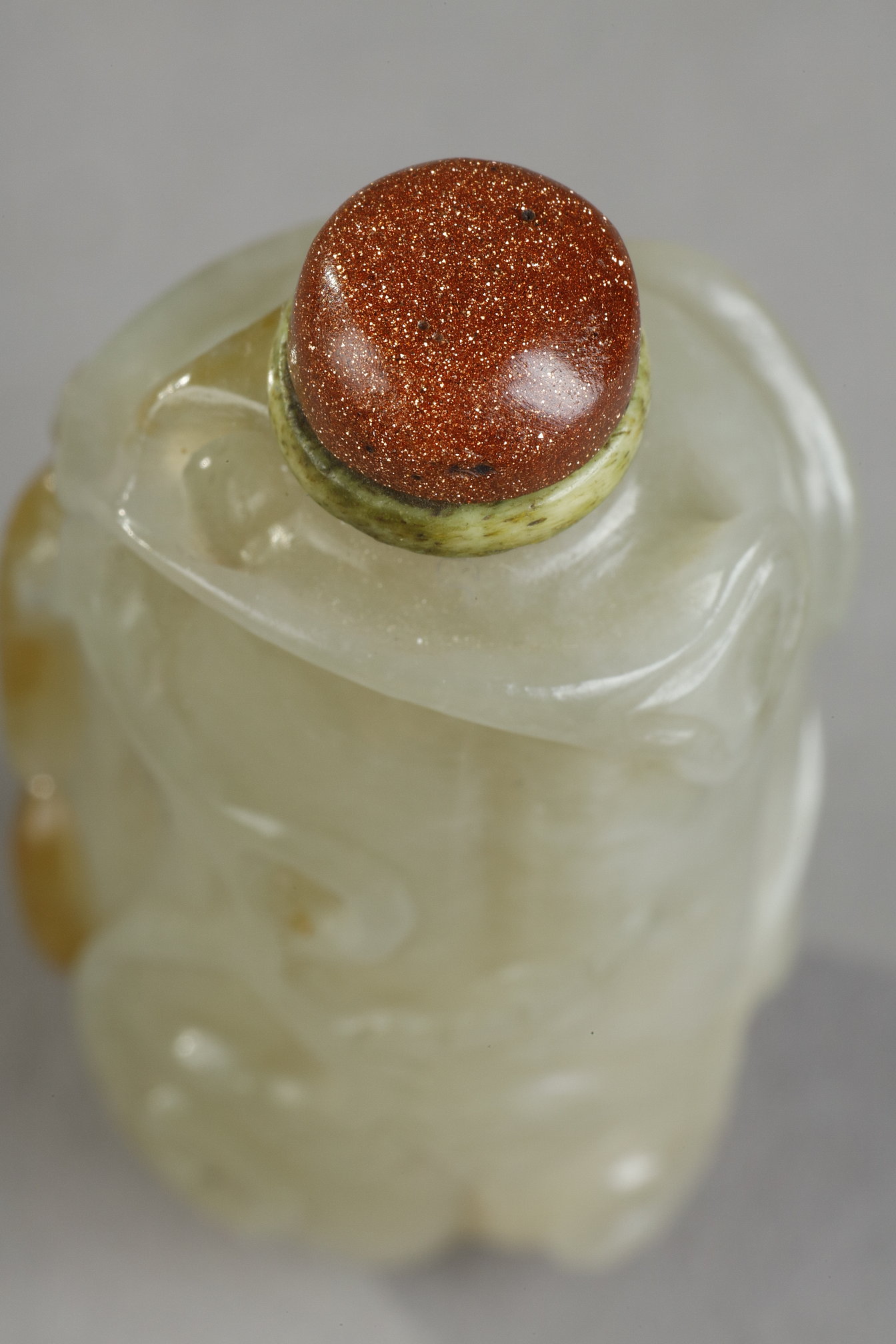 Snuff Bottles : Celadon green nephrite jade snuffbottle in the shape of .pumpkin with its leaves and another small fruit in a reddish brown inclusion - China 19th century