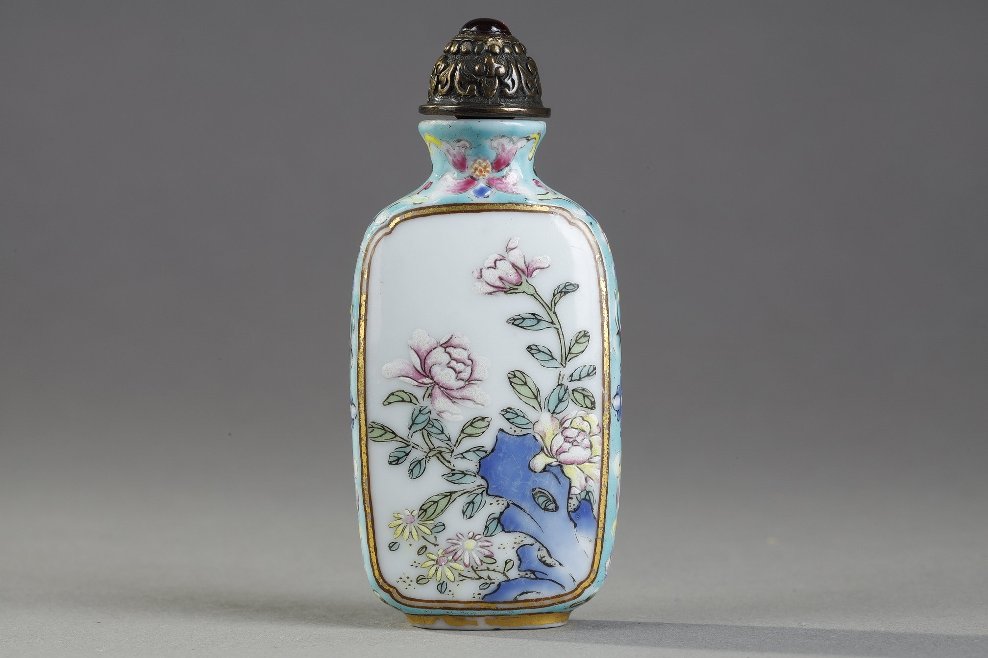 Snuff Bottles : Porcelain snuff bottle finely painted  with flowers and rock on a side  other side
with a poem of emperor Qianlong  - Imperial mark period Qianlong 1736/1795 