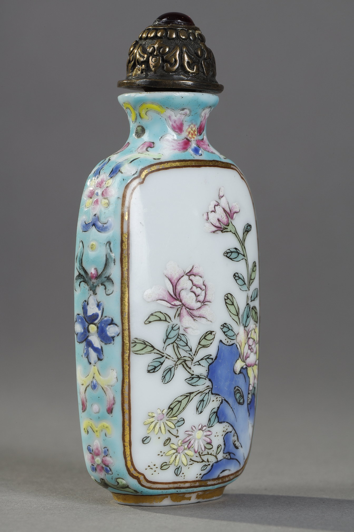 Snuff Bottles : Porcelain snuff bottle finely painted  with flowers and rock on a side  other side
with a poem of emperor Qianlong  - Imperial mark period Qianlong 1736/1795 