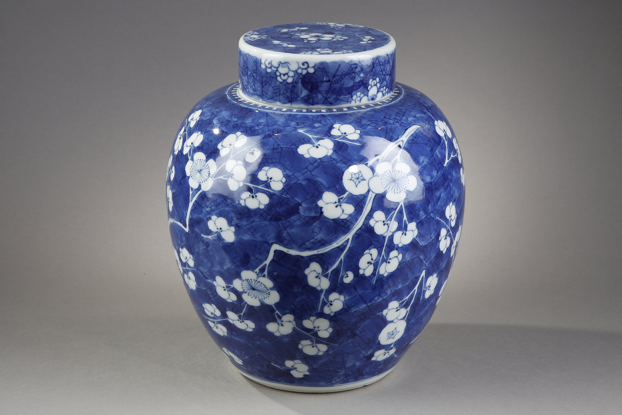Blue White : Ginger pot and its "blue-white" porcelain cover decorated with prunus branches in flowers on a blue background called "cracked ice"   China Kangxi period 1662/1722