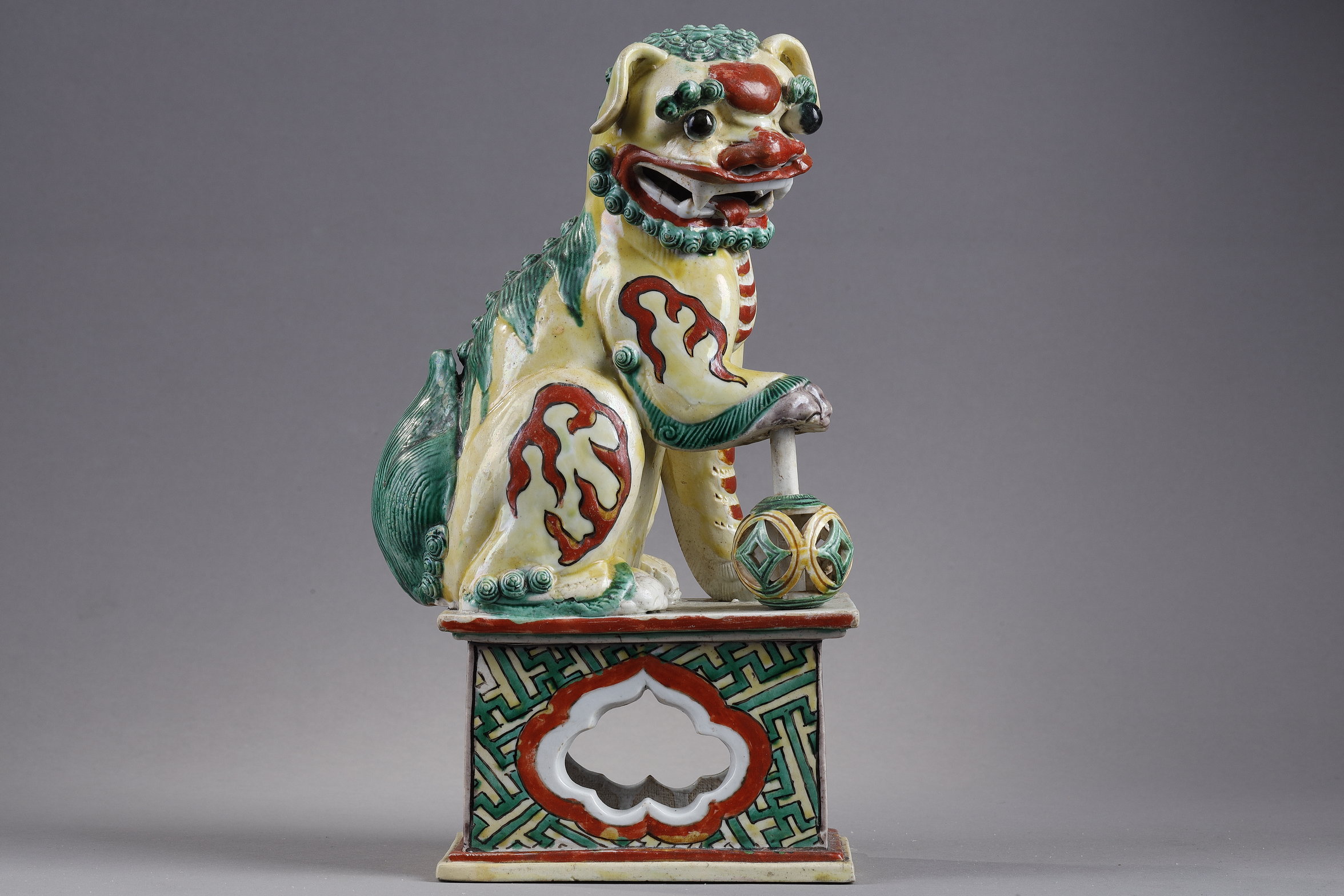 Polychrome : figure representing a Buddhist lion in enameled biscuit yellow ,green and  iron red China Qing period  18/19th century
